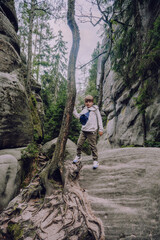 Naklejka premium Kid at Adrspach-Teplice Rocks, nature adventure