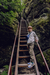 Kid at Adrspach-Teplice Rocks, nature adventure