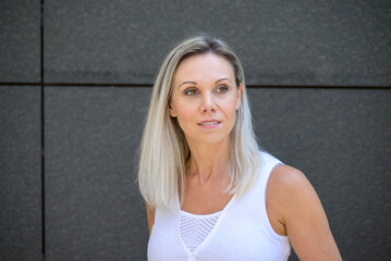 Pretty blond woman with a quiet oensive expression