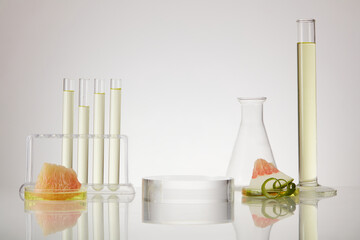 Laboratory concept with many scientific glassware containing essential oil extracted from pink...