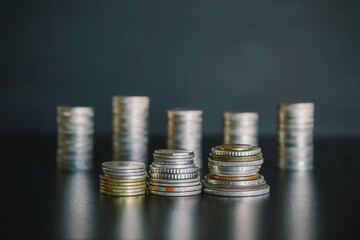 Stack of silver money coins on the table