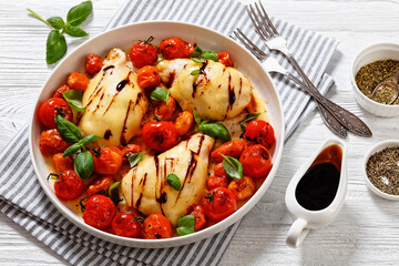 caprese chicken in white baking dish, top view