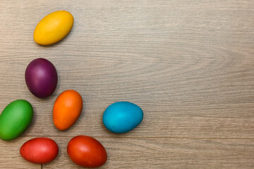 Traditional painted Easter eggs on wooden background. Colorful background of Easter eggs collection, Easter celebration