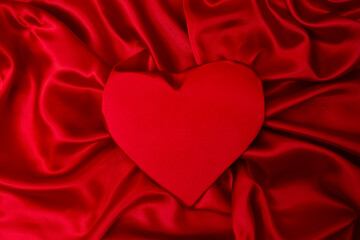 red heart with satin folds background, romantic backdrop