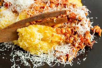Boiled corn flour, polenta, with minced pork meat and tomato sauce, ragu,