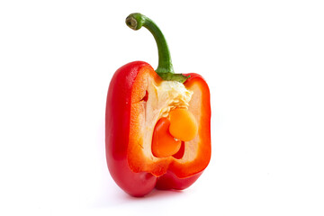 baby bell pepper inside a cross sectioned pepper, isolated on white