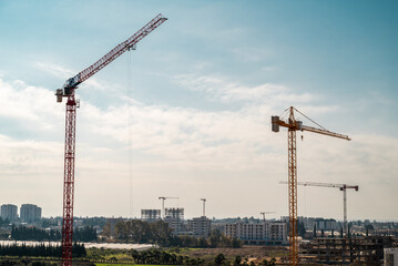 Fototapeta na wymiar Construction crane working on large construction site