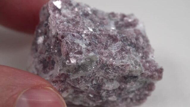 Mineral stone lepidolite. Macro shooting of natural gemstone. The raw mineral.