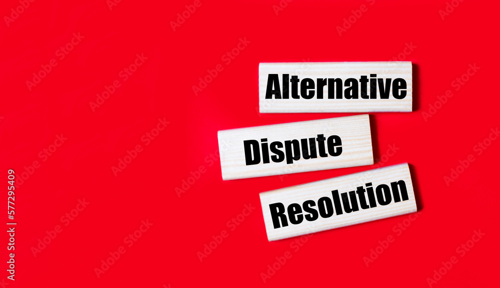 Poster three wooden blocks with the text adr alternative dispute resolution on a bright red background. cop