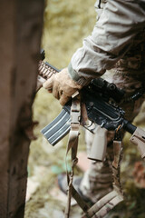 Military in war with camouflage dress and weapons