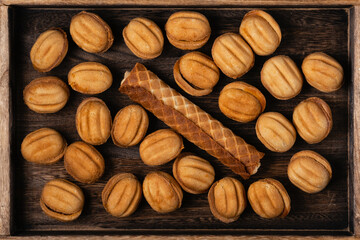 Tasty walnut shaped cookies with boiled condensed milk and sweet tube with condensed milk