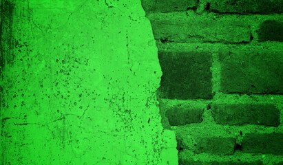 A textured green grunge background with dark patches and rough surface