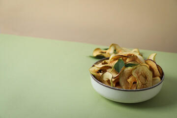 Concept of tasty food, dried apple chips, space for text