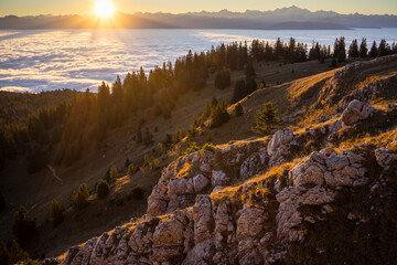 Sunrise over the alps and Lake Geneva basin, on a foggy day
