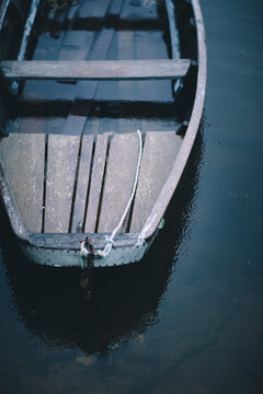 An old wooden boat is docked on the banks of the Loire River in France.