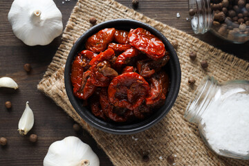 Concept of tasty food - sun-dried tomato, top view