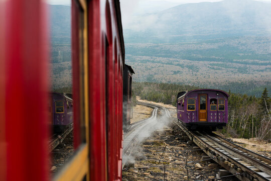 Trains passing each other on the tracks of the cog railway on Mount Washington, NH