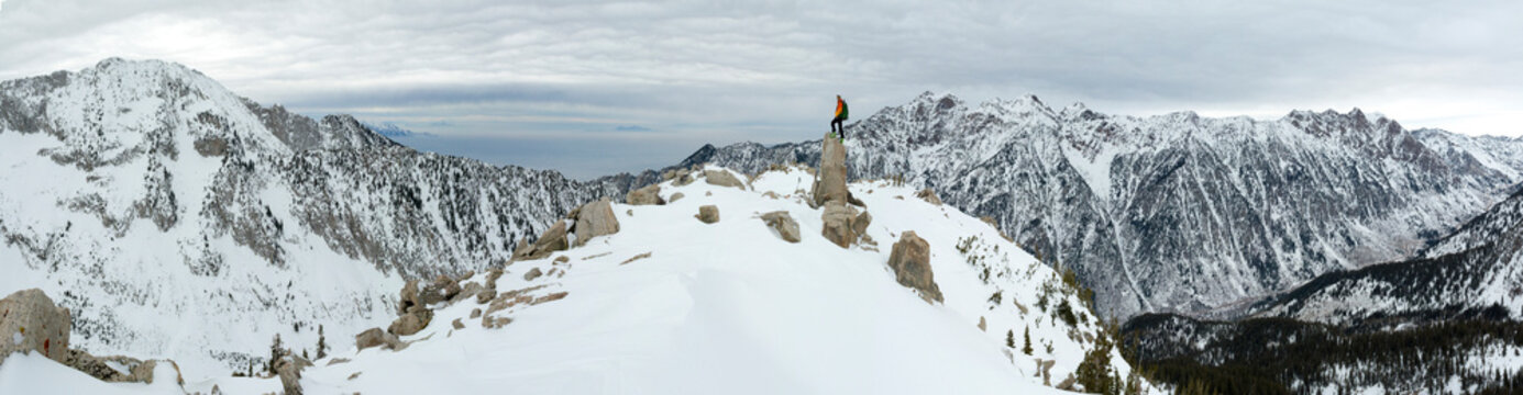A man stading on granite spire in Little Cottonwood Canyon, Salt Lake City, Utah.