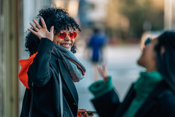 friends greeting each other on the city street