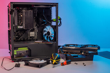 Building of PC, ATX motherboard and computer power supply unit inserted to black midi tower case
