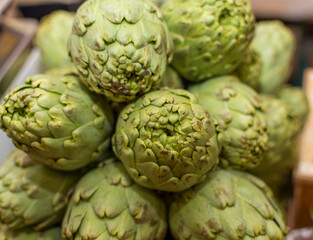 A bowl of artichokes with the word artichoke on it
