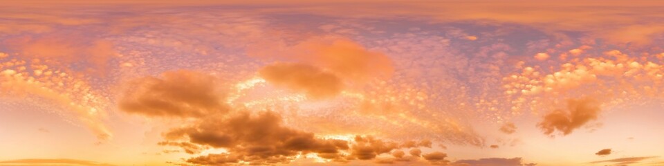 Golden glowing sunset sky panorama pink orange clouds. Hdr seamless spherical equirectangular 360...