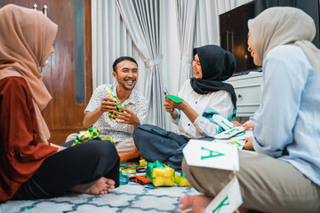 the joy of making ornamental ketupat plaits together for Eid celebrations at home