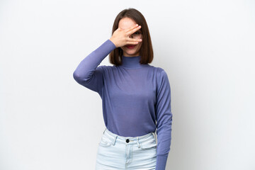 Young Ukrainian woman isolated on white background covering eyes by hands and smiling