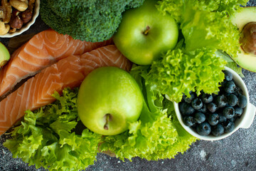 Different vegetables, seeds and fruits on grey table, flat lay.