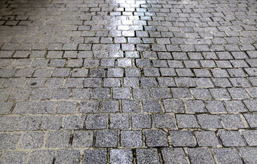 Wet cobblestone floor