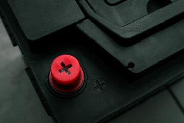 Positive mark of the old battery. Charging car battery with electric current. Concept of service,...