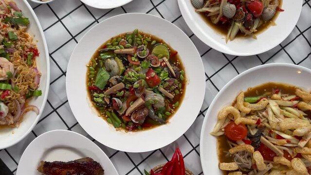 A set of original Northeastern Thai food or Isaan food, local food including Som Tum, 