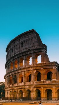 Vertical Footage Rome, Italy. Colosseum Also Known As Flavian Amphitheatre In Night Time. Close-up View.