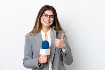 Young caucasian TV presenter woman isolated on white background giving a thumbs up gesture