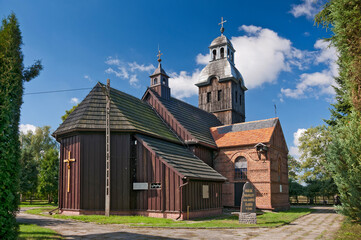 Fototapeta na wymiar Wooden church of St. Hedwig of Silesia in Staw, Greater Poland Voivodeship, Poland