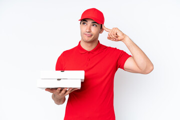 Pizza delivery caucasian man with work uniform picking up pizza boxes isolated on white background...