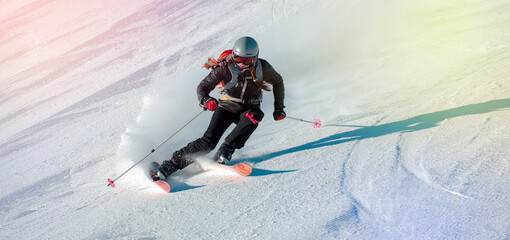Girl On the Ski. Active winter holidays, skiing downhill in sunny day. Woman skier