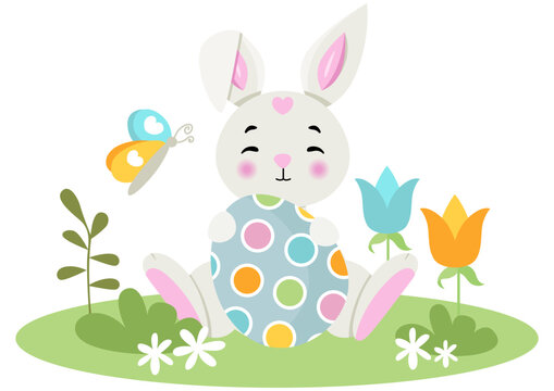 Cute bunny holding a Easter egg in the garden