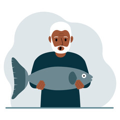 A old male fisherman holds a large fish, proud of good fishing or hunting. Hobby, fishing concept.