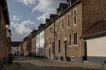 View of 'HH Geest' street and historic buildings in the Beguinage of Diest, in Flemish Brabant and...