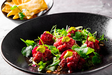 Raw beef meat tartar in plate 