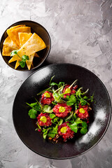 Raw beef meat tartar in plate 