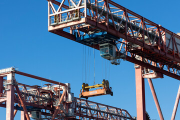 Fototapeta na wymiar GENOA, ITALY, FEBRUARY 2, 2023 - Man at work on a crane in the port of Genoa, Italy