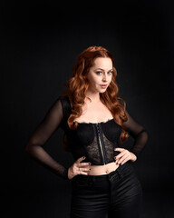 close up portrait of beautiful woman with long red hair wearing sheer corset top. variety of facial...