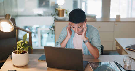 Laptop, business asian man and stress, tired or headache working in office with fatigue, anxiety or depression. Sad, depressed and mental health risk of digital online worker or employee burnout and