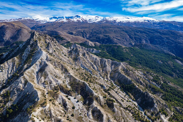 Aerial panoramic view of the mountains and valleys in the Sierra Nevada mountains in Spain	