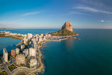 Aerial panorama view of the Calp Coastline: Ifach Penon and skyscrapper buildings, Aerial drone...