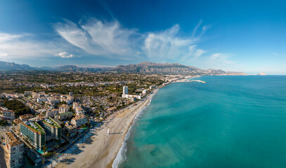 Aerial panorama of beautiful sand beach with turquoise mediterranean sea and town of Altea, Costa...