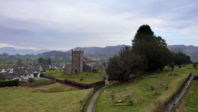 Drone, aerial footage of the historic village of Hawkshead a ancient town in the Lake District, Cumbria. The village is still the same collection of tiny houses, and squares