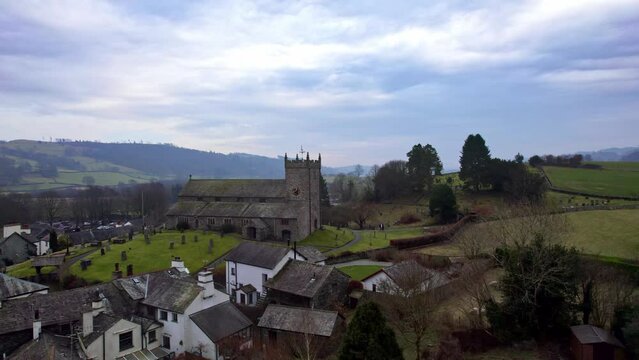 Drone, aerial footage of the historic village of Hawkshead a ancient town in the Lake District, Cumbria. The village is still the same collection of tiny houses, and squares